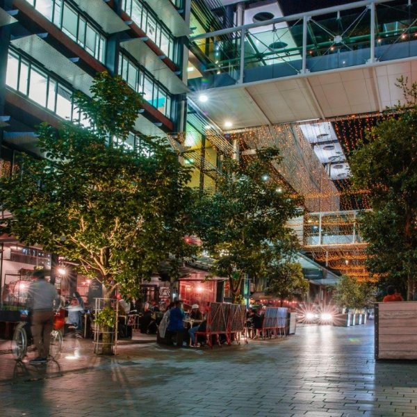 People enjoying an evening of food, drink and company under the fairy lights on Federal Street in Auckland's city centre. Image: Sacha Stejko.