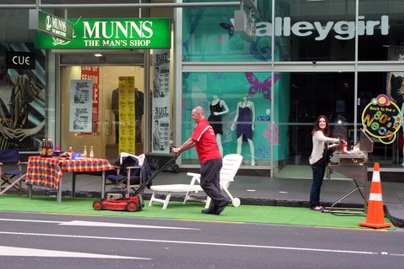 Lawnmowing and barbequeing in Queen Street for Park(ing) Day in Auckland's city centre, 2009.