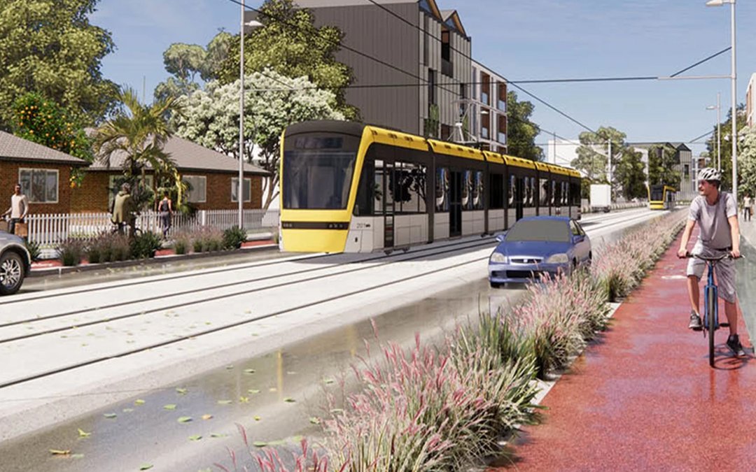 An artist's impression of a light rail modern tram shown in a suburban Auckland street, with a cyclist and car also sharing the road space. Image: Auckland Light Rail